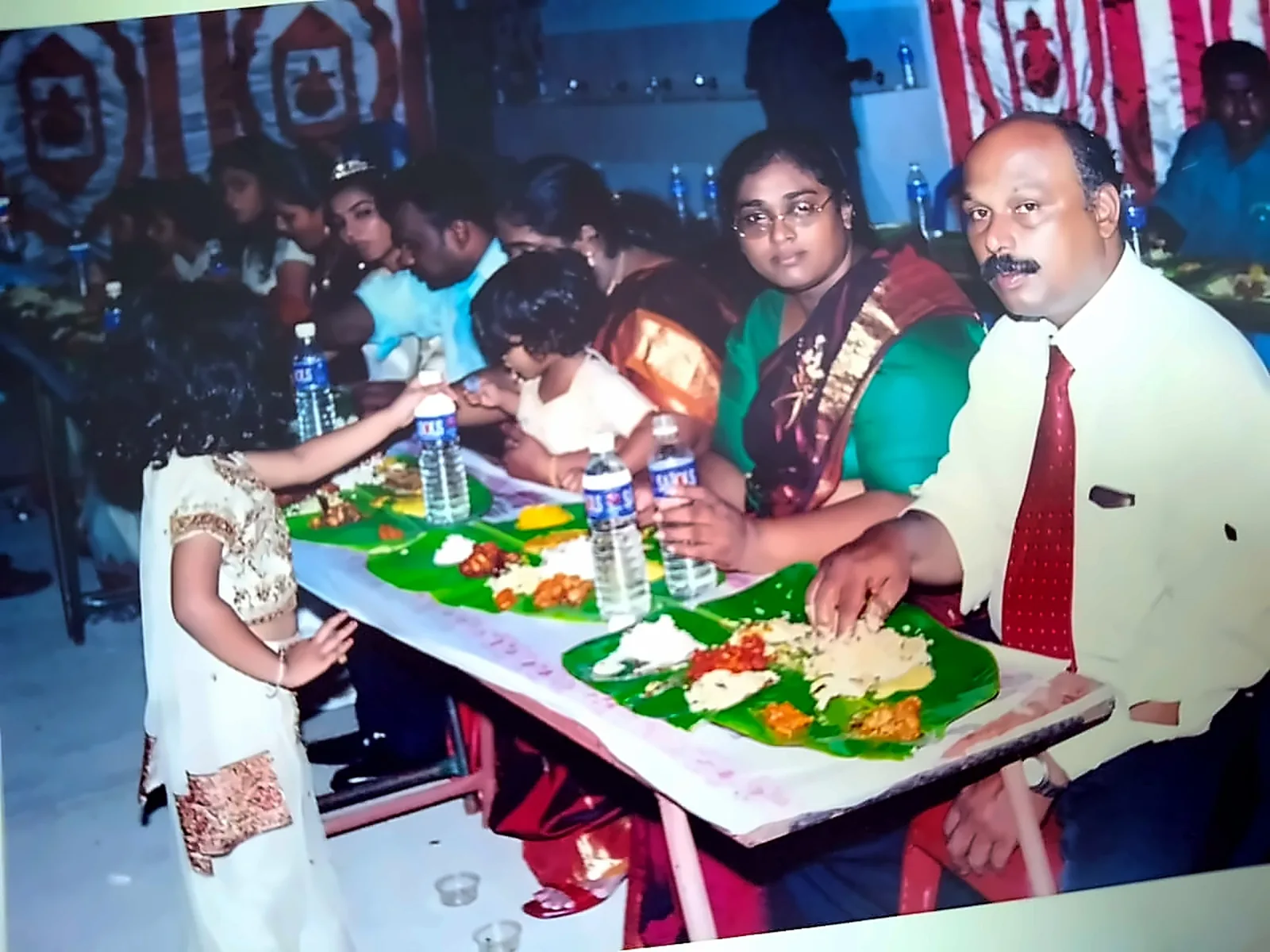 Family seated for a traditional South Indian banana-leaf sapadu catered in Chennai