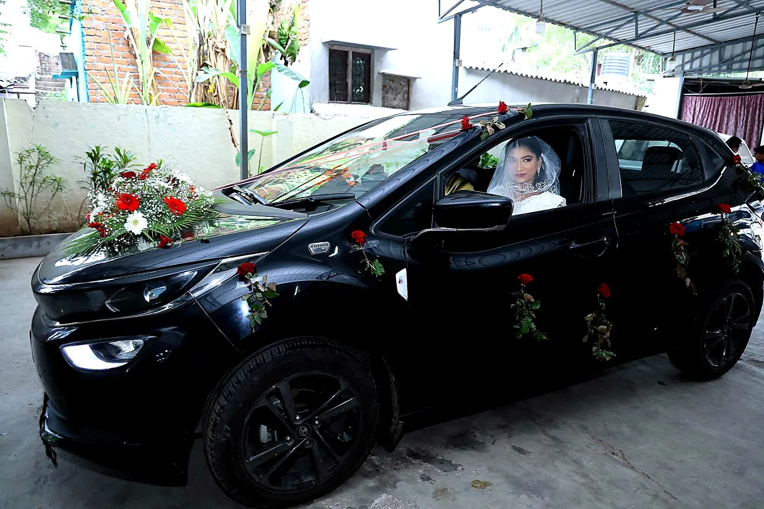 Bridal car decorated with fresh white and pink flowers for a Chennai wedding arrival