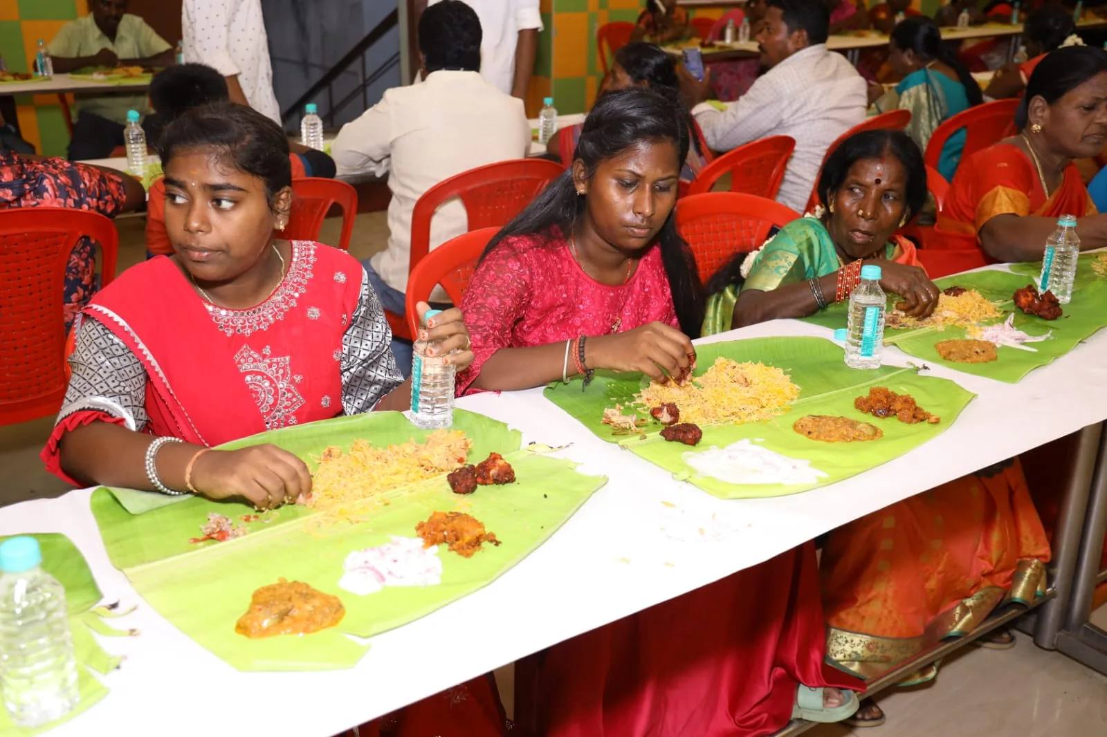 Guests enjoying a banana-leaf feast at the wedding catered by Joy Events